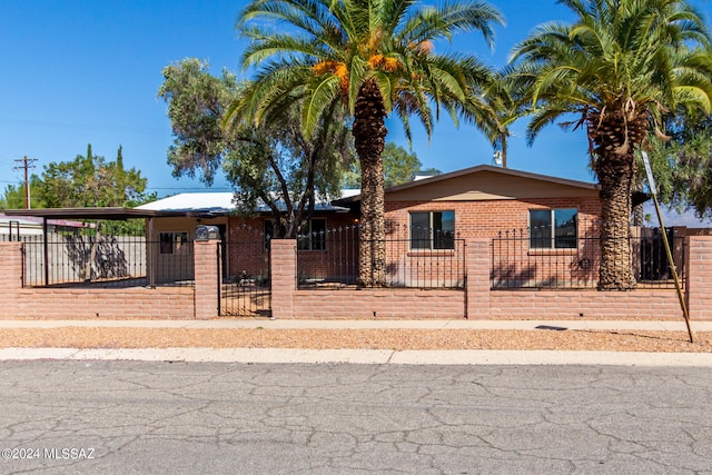 view of front of home featuring a carport