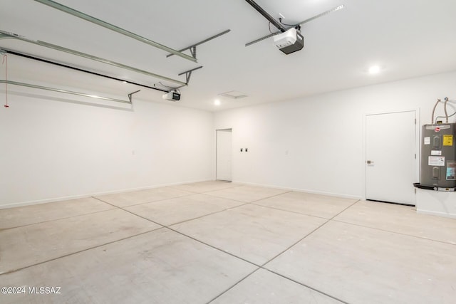 garage featuring a garage door opener and electric water heater