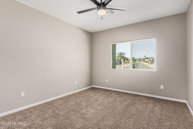 carpeted empty room featuring ceiling fan