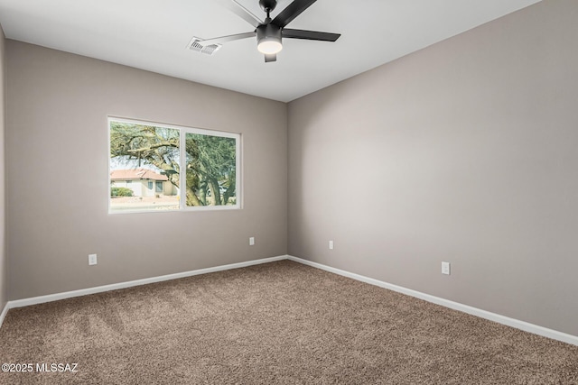 spare room featuring ceiling fan and carpet flooring