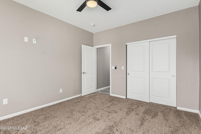 unfurnished bedroom featuring a closet, ceiling fan, and carpet