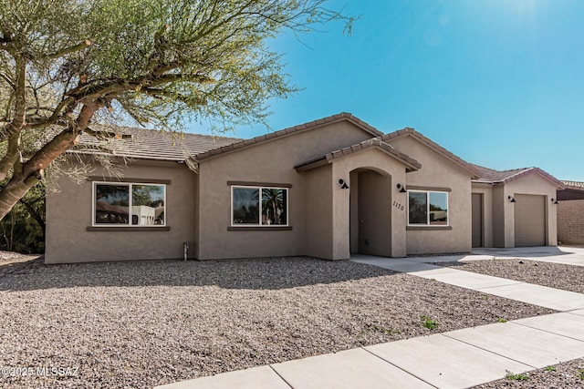 view of front of home with a garage