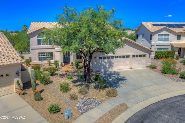 view of front of property with a garage