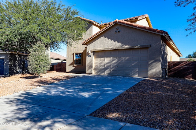 view of front of property featuring a garage