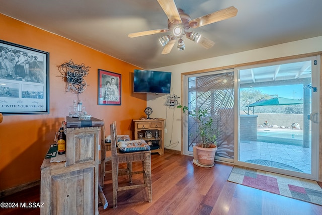 interior space with ceiling fan and hardwood / wood-style floors