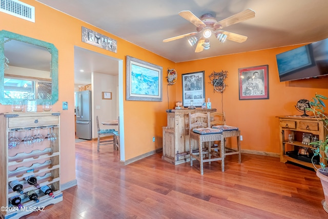 office area with ceiling fan and wood-type flooring