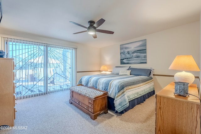 carpeted bedroom featuring access to outside and ceiling fan