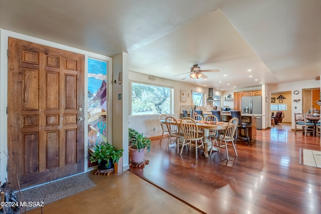 dining area featuring ceiling fan and wood-type flooring