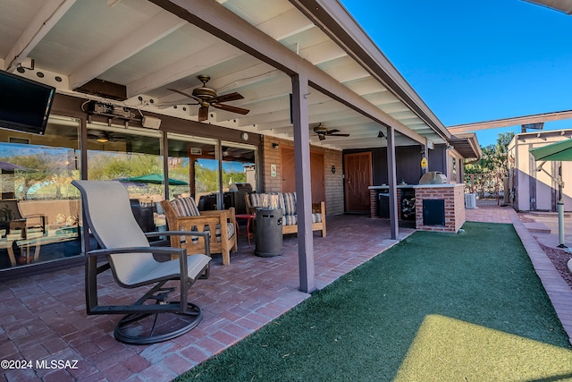 view of patio / terrace featuring ceiling fan, cooling unit, and exterior kitchen