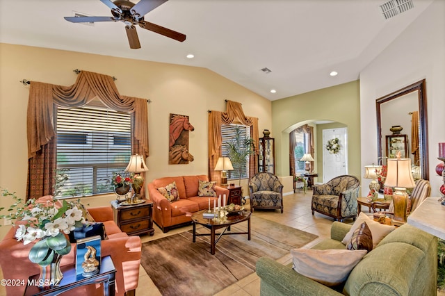 tiled living room featuring vaulted ceiling and ceiling fan