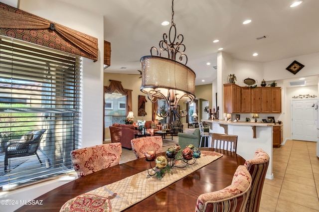 tiled dining area featuring an inviting chandelier