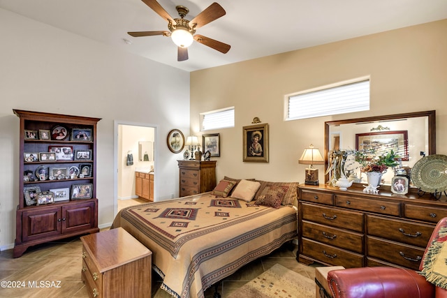 bedroom featuring ensuite bath and ceiling fan