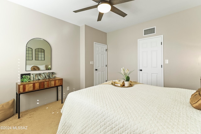 carpeted bedroom with ceiling fan