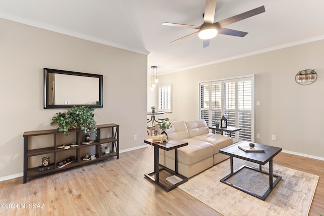 living room with light wood-type flooring, ceiling fan, and ornamental molding