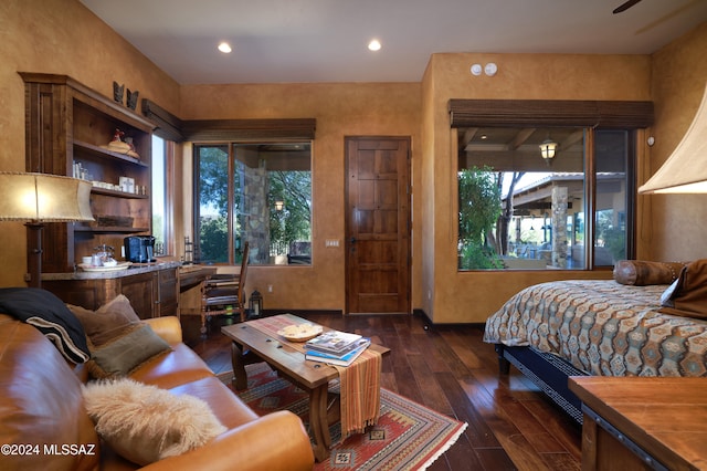 bedroom with dark hardwood / wood-style flooring