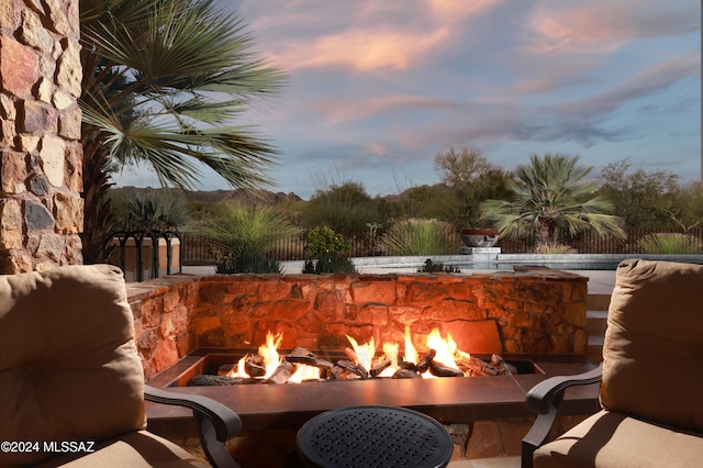 exterior space featuring an outdoor fire pit