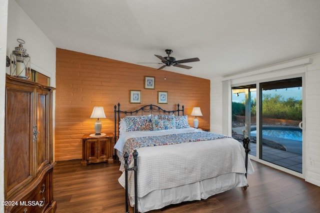 bedroom with access to exterior, ceiling fan, dark hardwood / wood-style flooring, and lofted ceiling