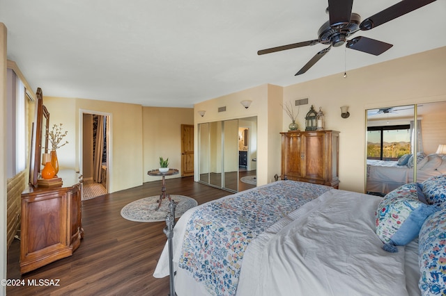 bedroom with dark hardwood / wood-style floors and ceiling fan