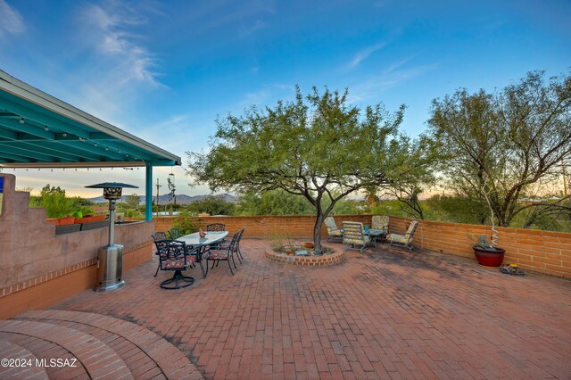 view of patio terrace at dusk