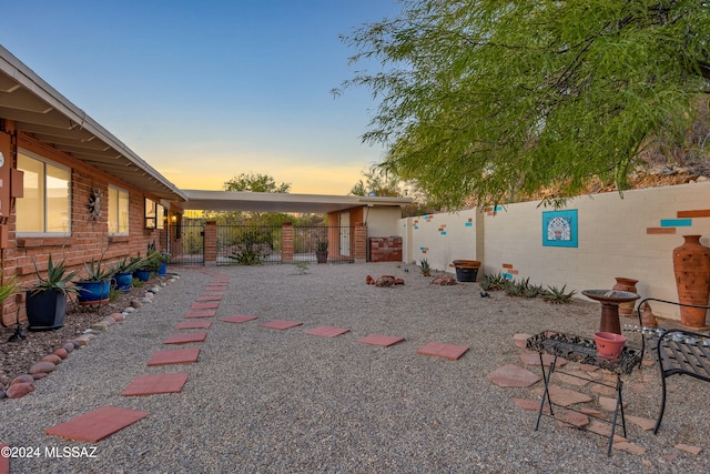 view of yard at dusk