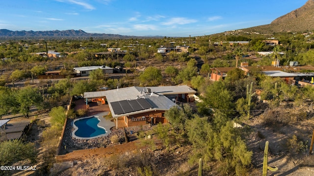 birds eye view of property featuring a mountain view