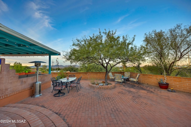 view of patio terrace at dusk