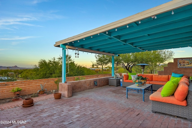 patio terrace at dusk with an outdoor living space