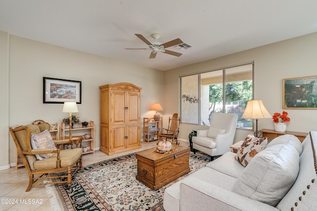 tiled living room with ceiling fan