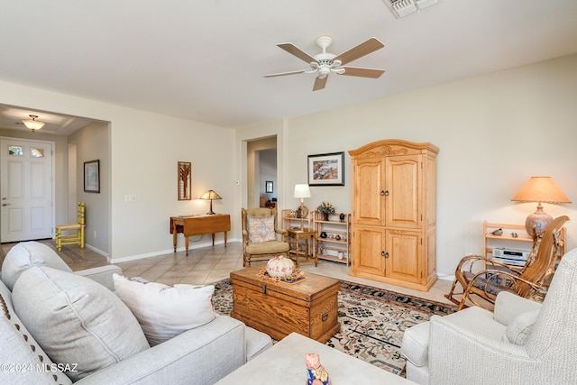 tiled living room featuring ceiling fan