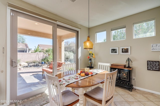 tiled dining room with plenty of natural light