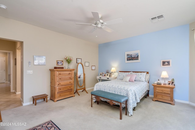 bedroom featuring light colored carpet and ceiling fan