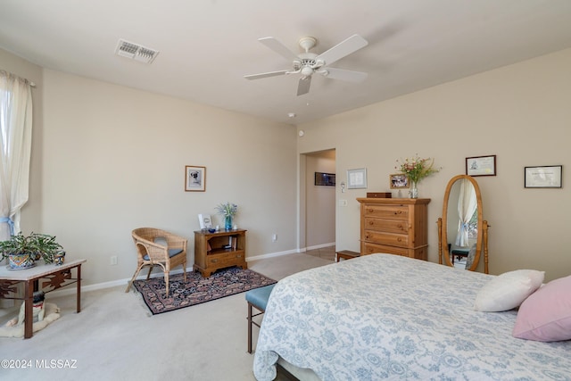 bedroom with ceiling fan and light colored carpet