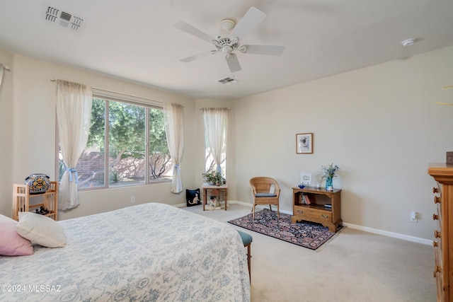 bedroom featuring ceiling fan and light colored carpet