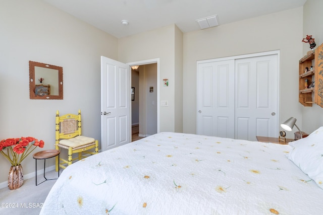 carpeted bedroom with a closet