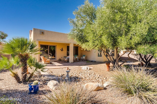 back of property with a patio area