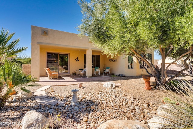 back of property with a patio area