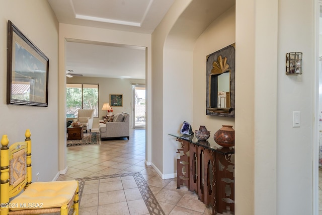 corridor featuring light tile patterned floors