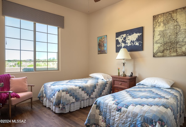 bedroom with dark wood-type flooring