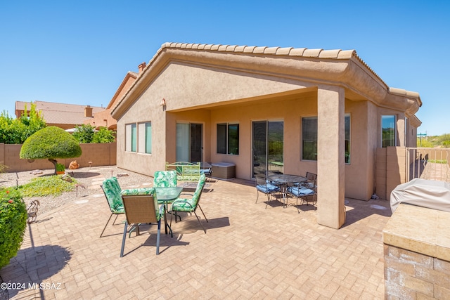 rear view of property with a patio