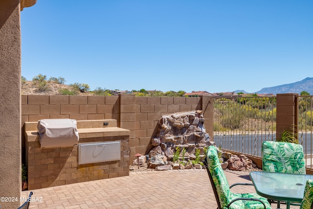 view of patio with a mountain view