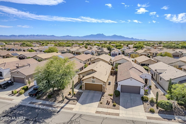 drone / aerial view featuring a mountain view