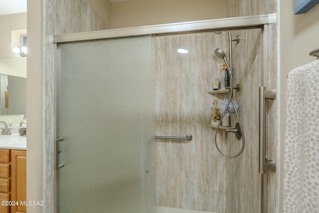 bathroom with vanity and walk in shower