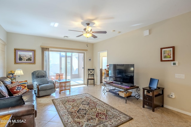 tiled living room featuring ceiling fan