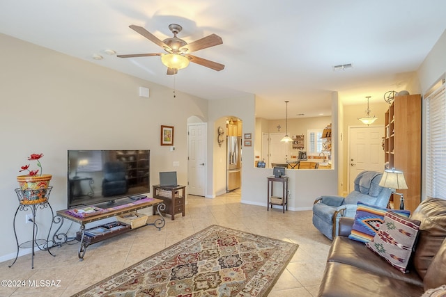 living room with light tile patterned floors and ceiling fan