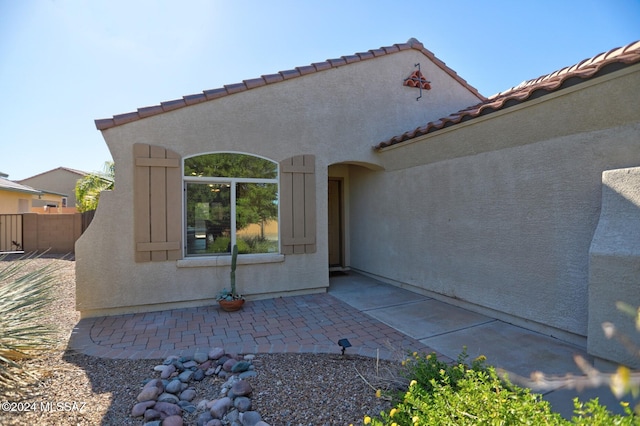 back of property featuring a patio