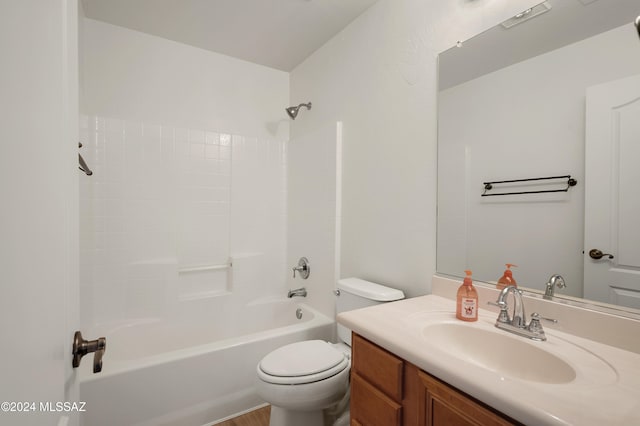 full bathroom with hardwood / wood-style floors, vanity, toilet, and shower / tub combination