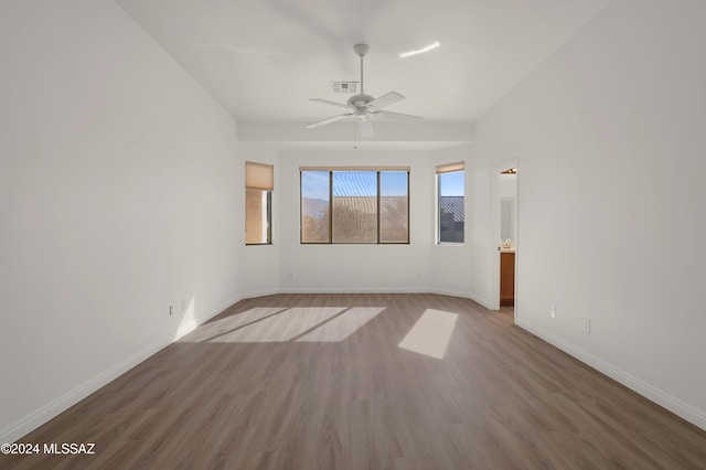 spare room featuring hardwood / wood-style flooring and ceiling fan