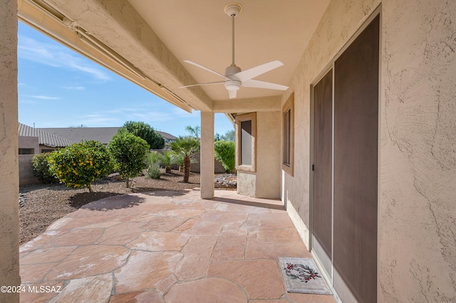 view of patio featuring ceiling fan