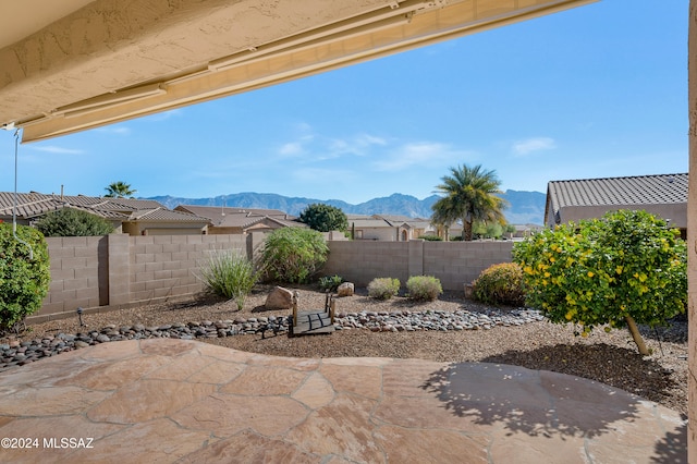 view of patio / terrace featuring a mountain view