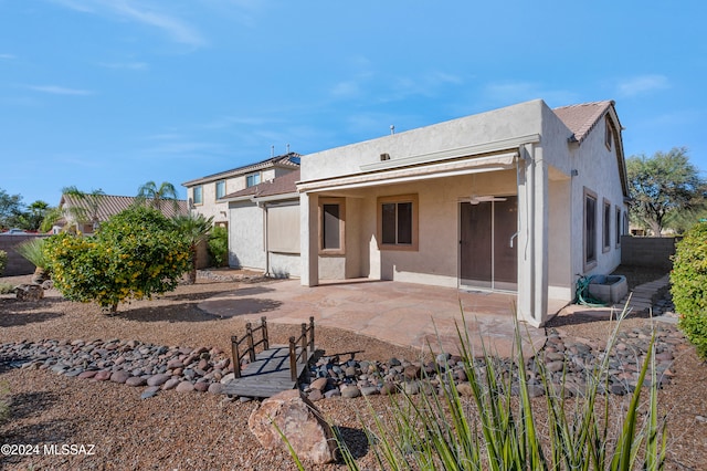 back of property featuring a patio area